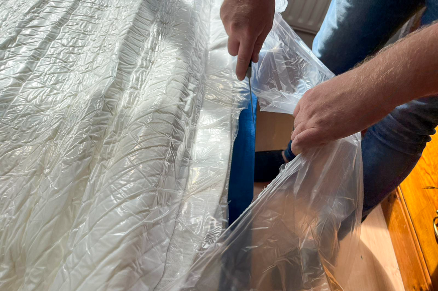 cutting away final hypnia mattress plastic layer
